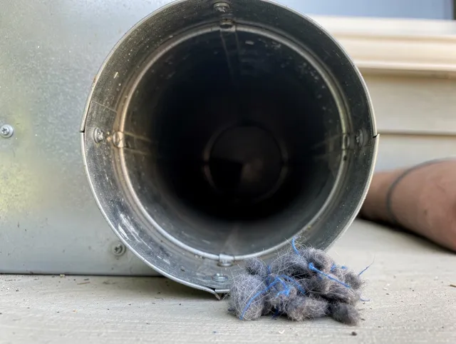 Black Forest Dryer Vent Cleaning technician using specialized equipment to clear severe dryer vent blockage in Black Forest